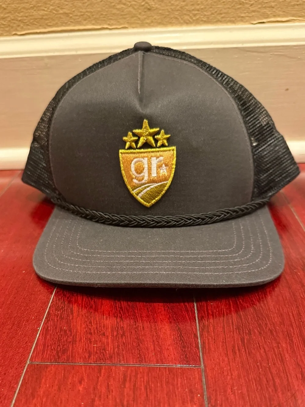 Gray Trucker Hat with Gold Shield Patch